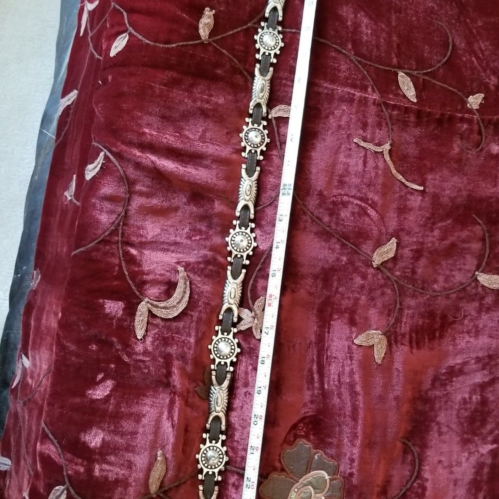 THIN BLACK CONCHO STYLE BELT ABOUT 3 FEET TO LAST PUNCH